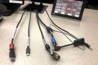Pedestal - laptop cable connections with cables pulled out showing cable ends
