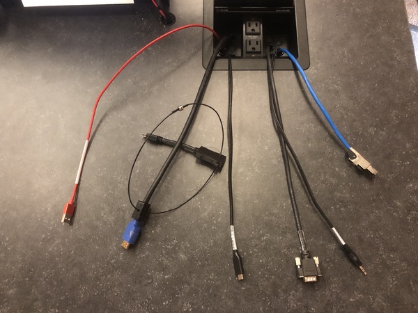 Pedestal - laptop cable connections with cables pulled out showing cable ends