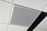 White 2¿ x 2¿ tile mounted in the ceiling to provide microphone coverage over student seating