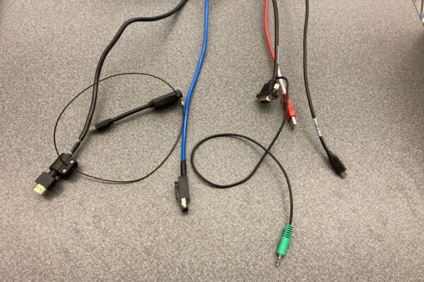 Pedestal - laptop cable connections with cables pulled out showing cable ends