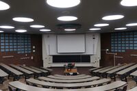 Front of room view with lectern in center of room