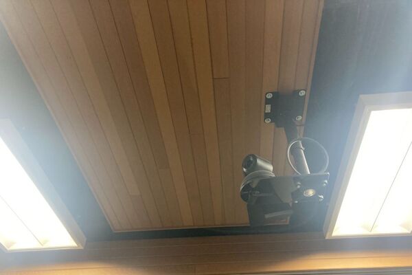 Camera mounted to ceiling and instructor enabled adjustments to the lens to allow the instructor to be "seen" by the camera in more locations around the room