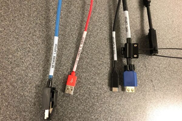 Pedestal - laptop cable connections with cables pulled out showing cable ends