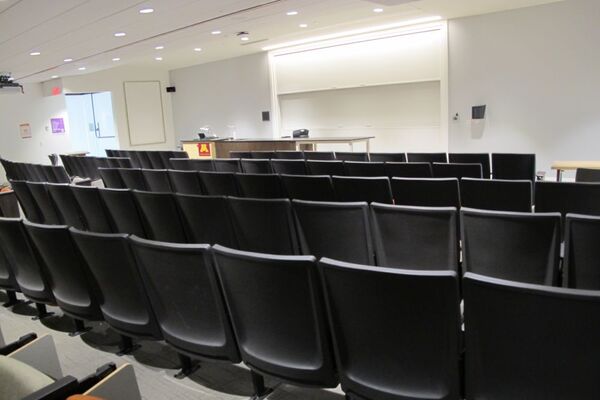 Front of room view with lectern and demonstration bench at left side of room