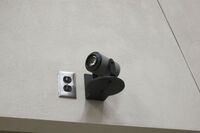 Camera mounted to a wall and instructor enabled adjustments to the lens to allow the instructor to be "seen" by the camera in more locations around the room