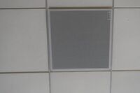 White 2¿ x 2¿ tile mounted in the ceiling to provide microphone coverage over student seating