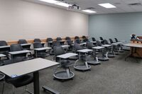 Back of room view of student tablet arm seating 