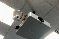 Camera mounted to ceiling and instructor enabled adjustments to the lens to allow the instructor to be "seen" by the camera in more locations around the room