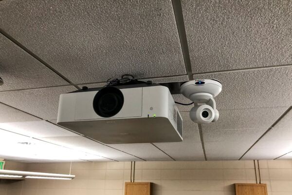 Camera mounted to ceiling and instructor enabled adjustments to the lens to allow the instructor to be "seen" by the camera in more locations around the room