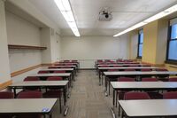 Rear of room view of student table and chair seating