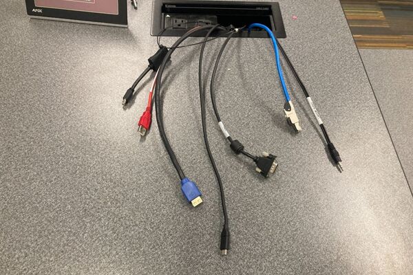 Pedestal - laptop cable connections with cables pulled out showing cable ends