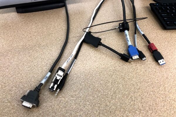 Pedestal - laptop cable connections with cables pulled out showing cable ends