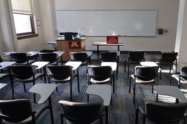 Front of room view with lectern on left in front of markerboard