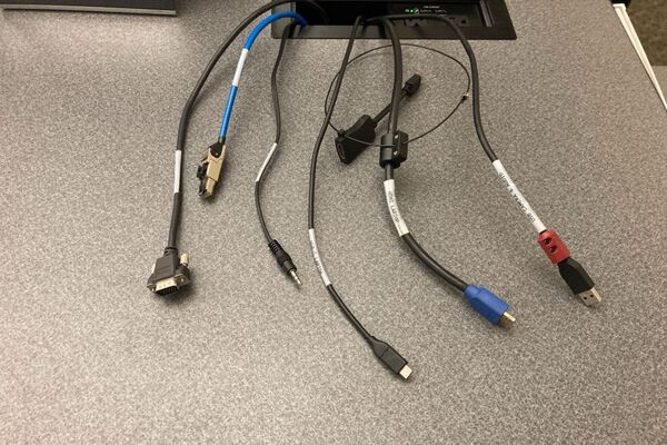 Pedestal - laptop cable connections with cables pulled out showing cable ends