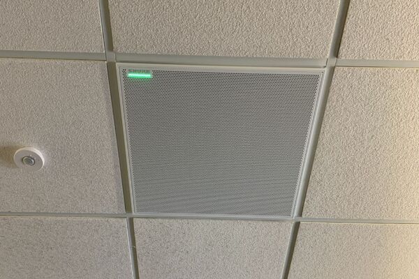 White 2¿ x 2¿ tile mounted in the ceiling to provide microphone coverage over student seating