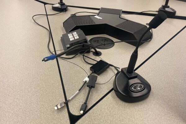 Close up of connections for student provided laptops and push-to-talk microphone