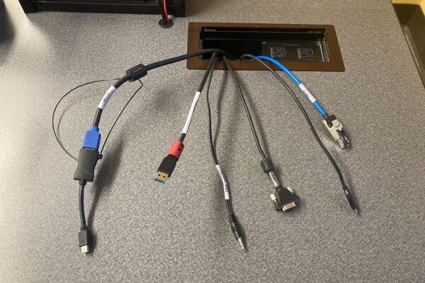 Pedestal - laptop cable connections with cables pulled out showing cable ends