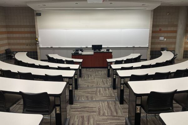 Front of room view with lectern center in front of markerboard 