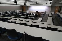 Front of room view with lectern center in front of markerboard 