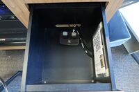 Pedestal - inside view of drawer showing two wireless mics in charging base