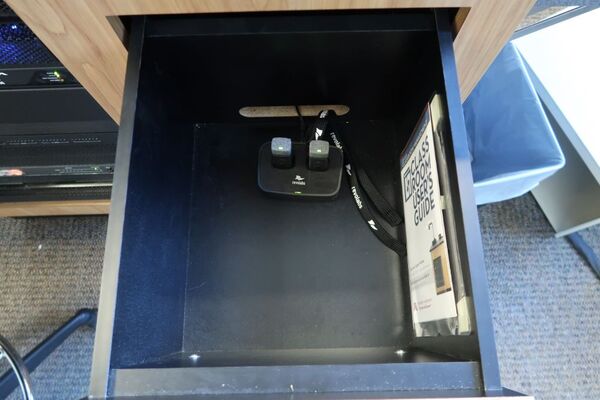 Pedestal - inside view of drawer showing two wireless mics in charging base