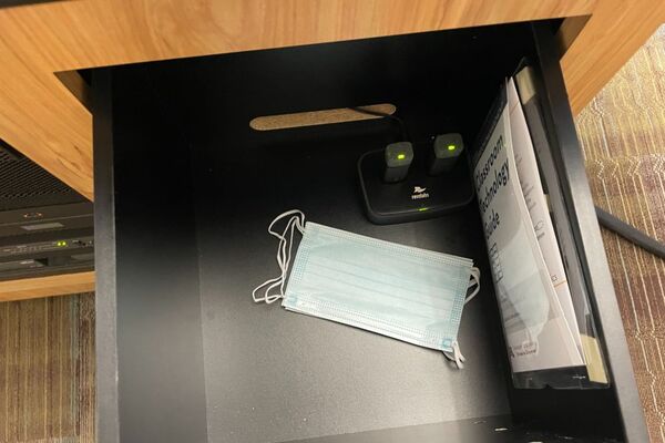 Pedestal - inside view of drawer showing two wireless mics in charging base