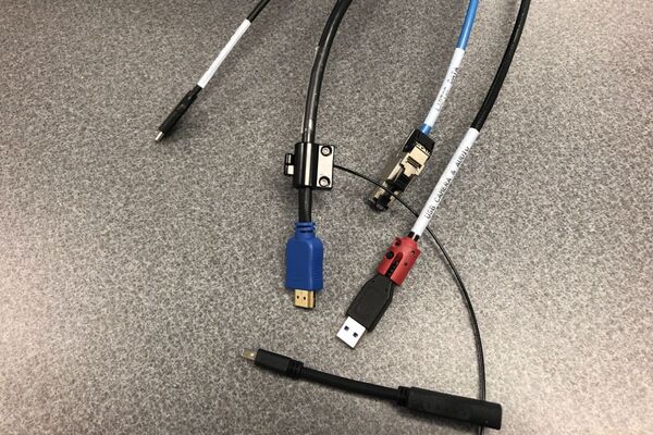 Pedestal - laptop cable connections with cables pulled out showing cable ends