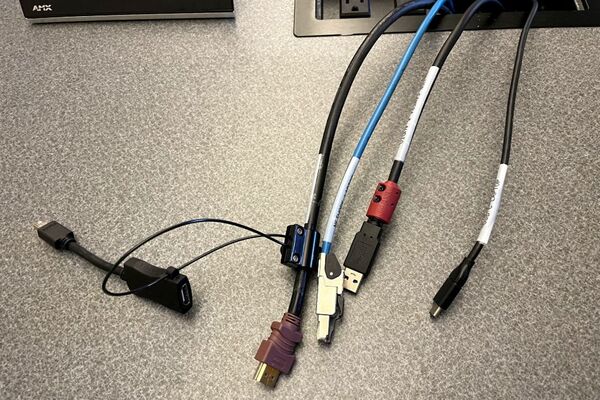 Pedestal - laptop cable connections with cables pulled out showing cable ends