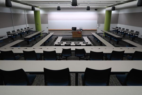 Front of room view with lectern center in front of markerboard 