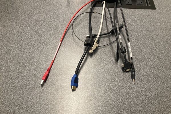 Pedestal - laptop cable connections with cables pulled out showing cable ends