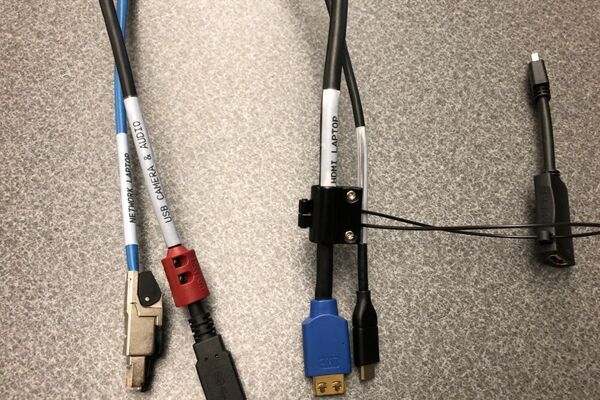 Pedestal - laptop cable connections with cables pulled out showing cable ends