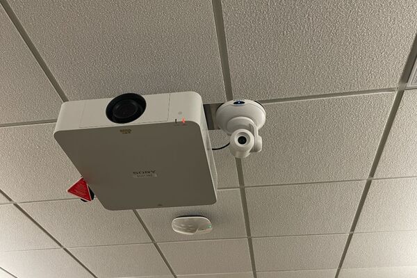 Camera mounted to ceiling and instructor enabled adjustments to the lens to allow the instructor to be "seen" by the camera in more locations around the room