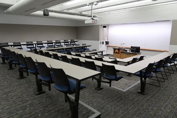 Front of room view with lectern center in front of markerboard 