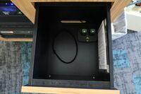 Pedestal - inside view of drawer showing two wireless mics in charging base