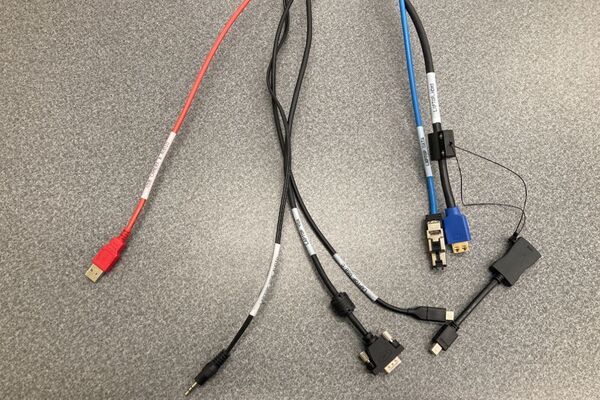 Pedestal - laptop cable connections with cables pulled out showing cable ends