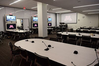 Photo of front of room from back of room with dividing wall on the left.