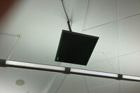 A 2¿ x 2¿ tile mounted to the ceiling to provide microphone coverage over student seating