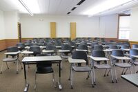 Back of room view of student tablet arm seating 