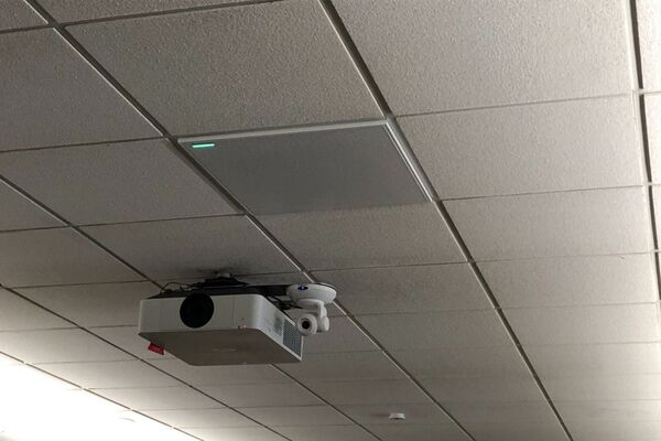 Camera mounted to ceiling and instructor enabled adjustments to the lens to allow the instructor to be "seen" by the camera in more locations around the room