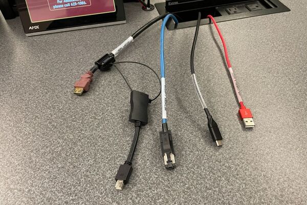 Pedestal - laptop cable connections with cables pulled out showing cable ends