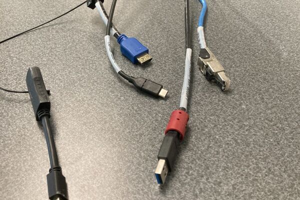 Pedestal - laptop cable connections with cables pulled out showing cable ends