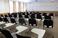  Front of room view with lectern on left in front of markerboard