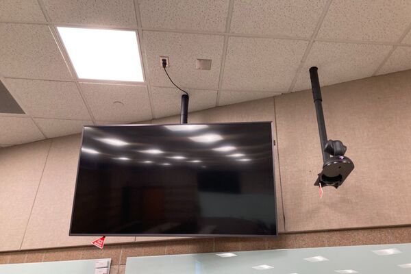 Monitor mounted so that students will be able to see remote participants without having to turn to look at the projection screen