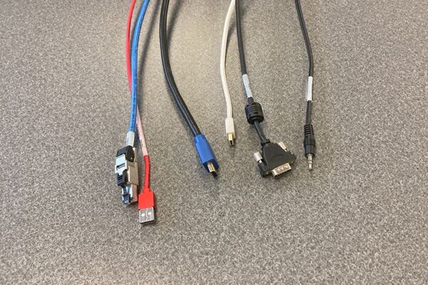 Pedestal - laptop cable connections with cables pulled out showing cable ends