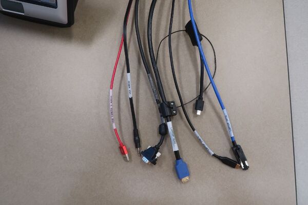 Pedestal - laptop cable connections with cables pulled out showing cable ends