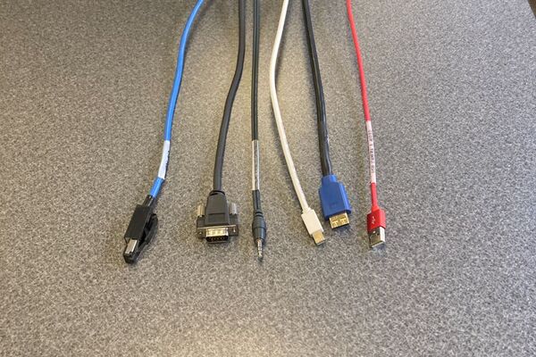 Pedestal - laptop cable connections with cables pulled out showing cable ends