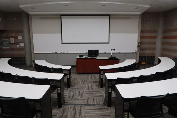 Front of room view with lectern center in front of markerboard 