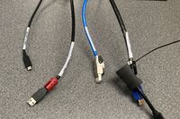 Pedestal - laptop cable connections with cables pulled out showing cable ends