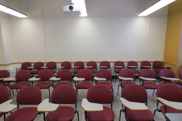 Rear of room view of student tablet arm chair seating