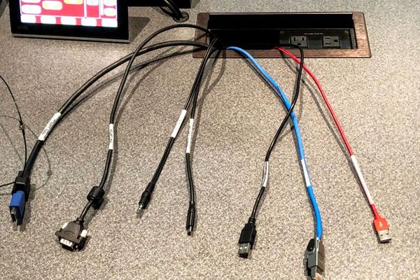 Pedestal - laptop cable connections with cables pulled out showing cable ends